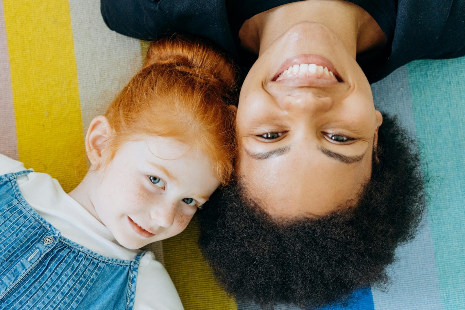An au pair playing with a young child